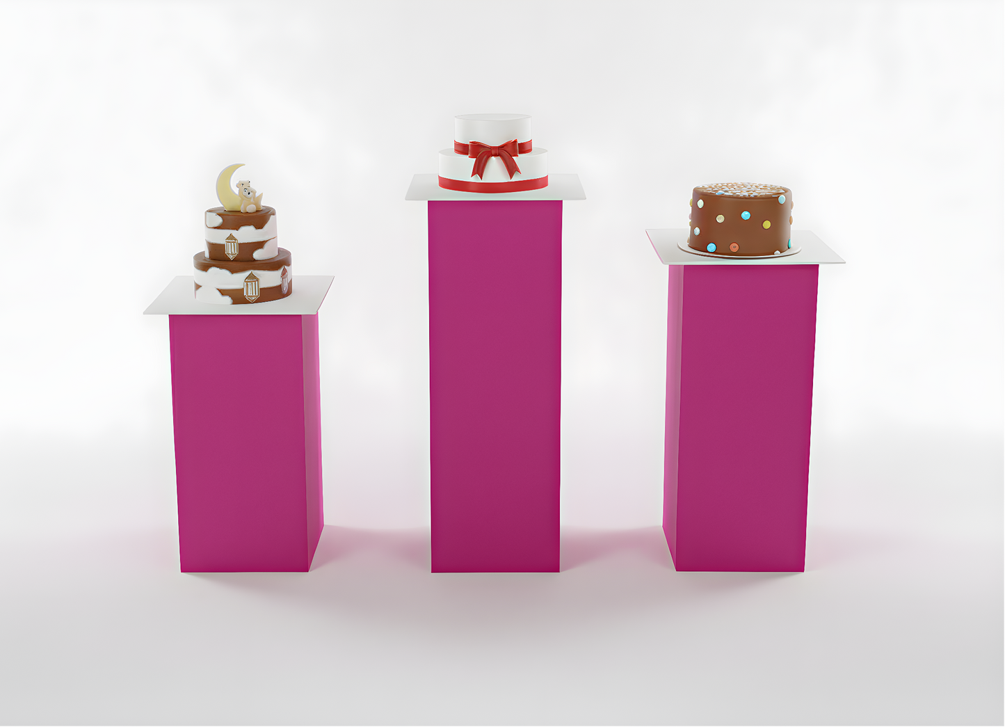 Three small cakes on pink stands against a white background